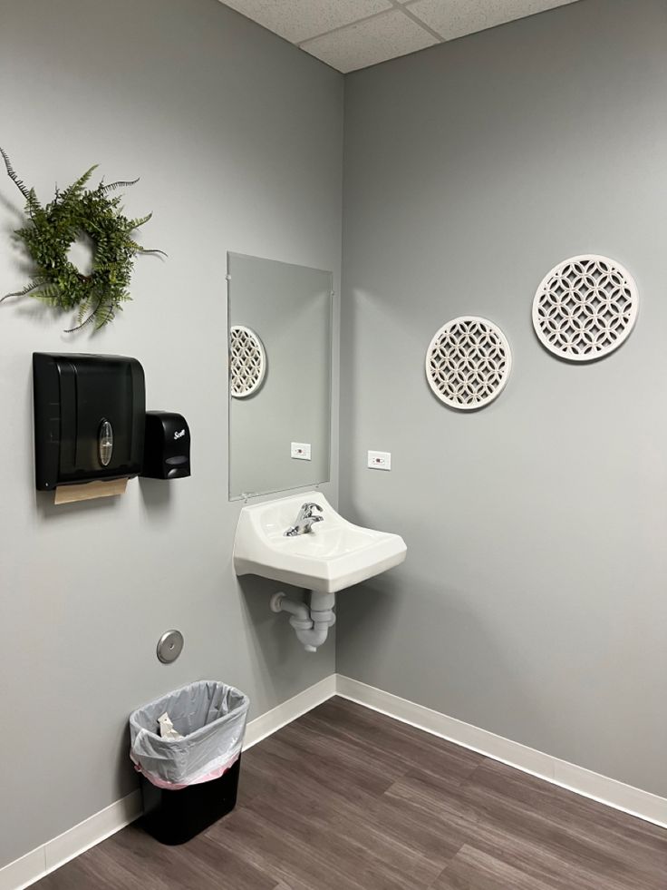 the bathroom is clean and ready to be used as a washroom or office space