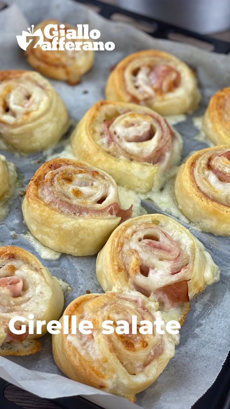 there are many different types of pastries in the pan on the table and one is ready to be eaten