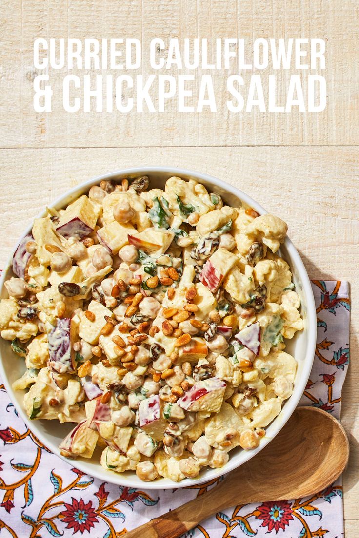 a white bowl filled with food on top of a table