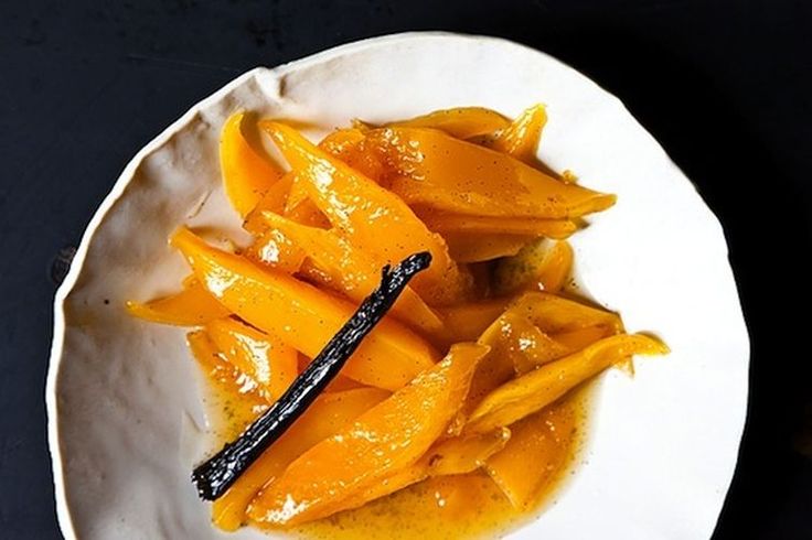 a white plate topped with cut up mangoes