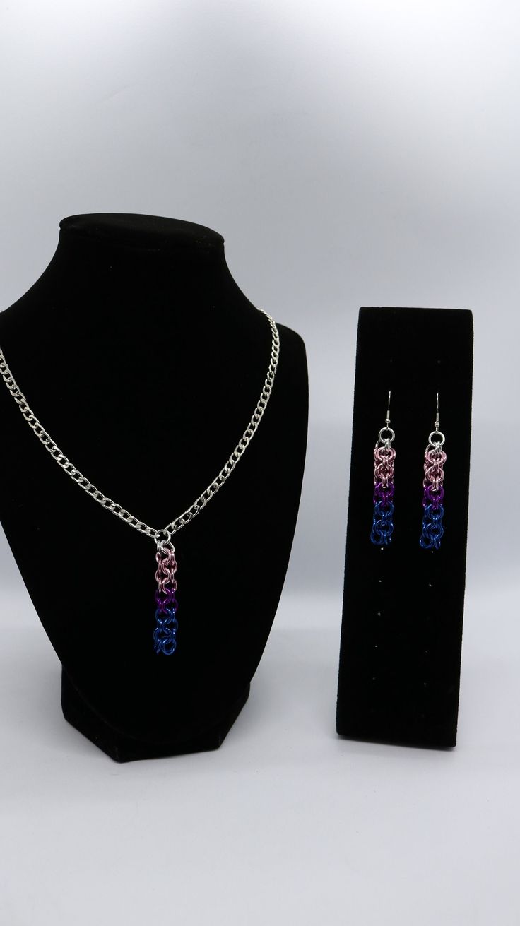 A chain pendant set based on the Bi Pride Flag. Available Ear hooks and necklace chain are both nickel free. Earrings and necklace are available independently or as a set. lgbtqia2s+. Nickel Free. Chain length for necklace can be selected in product variations Bisexual Pride Flag, Nickel Free Earrings, Earrings And Necklace, Free Earrings, Pride Flag, Ear Hook, Chain Pendant, Pride Flags, Pendant Set