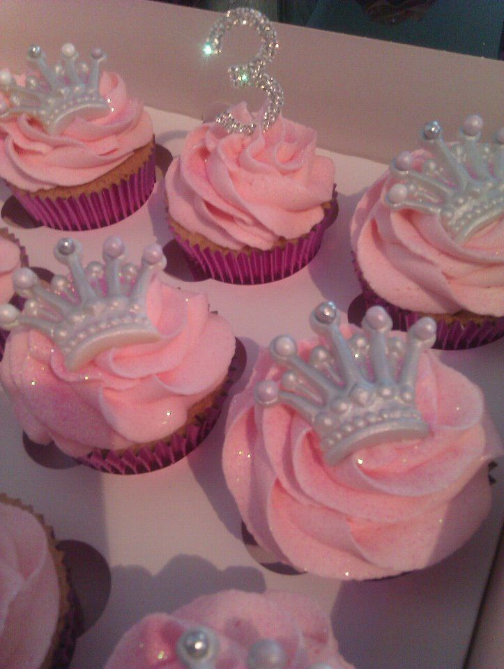 cupcakes with pink frosting and tiara decorations