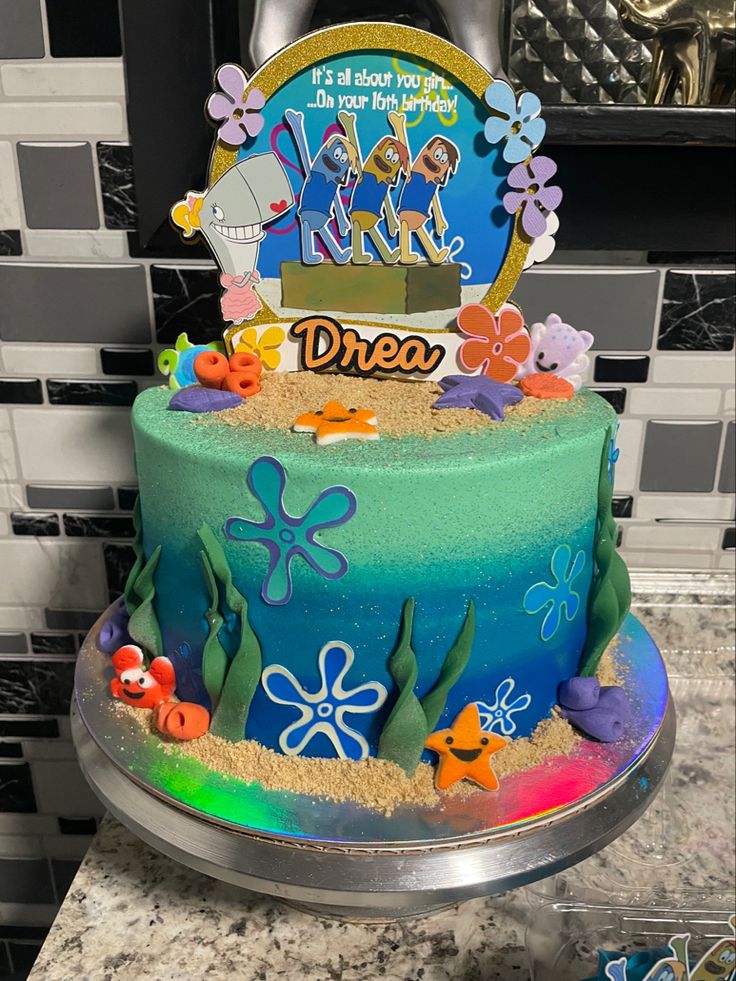 there is a cake that has been decorated with an image of the ocean on it