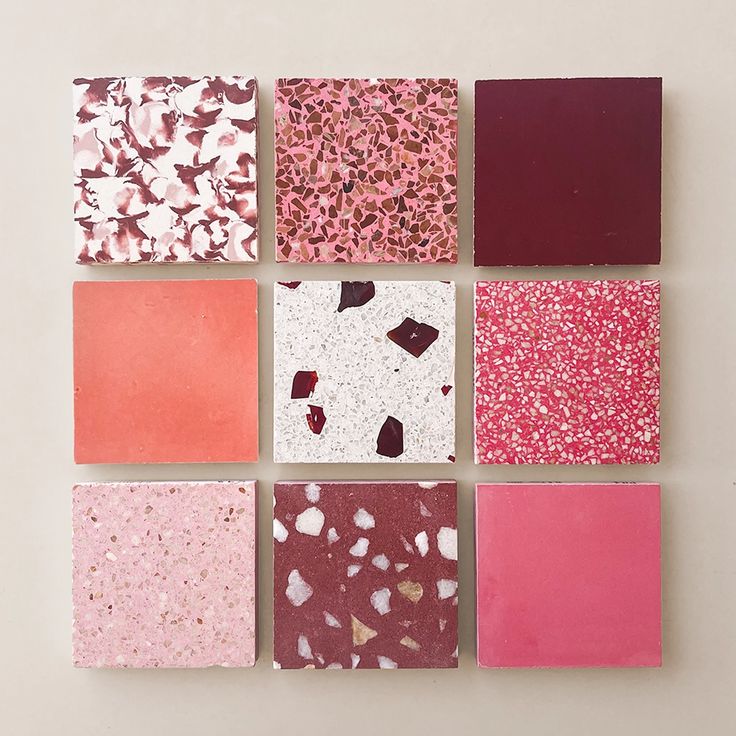 six different colored tiles arranged on top of each other in square shapes with small speckles