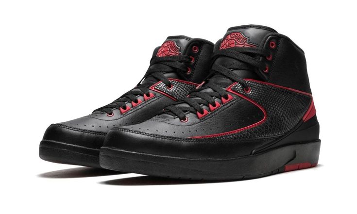 Black and varsity red leather Air Jordan 2 Retro sneakers from jordan featuring an ankle length, a lace-up front fastening, a round toe and a flat rubber sole.  Supplied by a premier sneaker marketplace dealing with unworn, already sold out, in demand rarities.  Each product is rigorously inspected by experienced experts guaranteeing authenticity. Luxury Leather Jordan Shoes Breathable, Black Leather Luxury Jordan Shoes, Luxury Black Leather Jordan Shoes, Jordan Retro 12 Stadium Goods, Air Jordan 2 Retro, Black Fade-resistant Synthetic Jordan Shoes, Air Jordan 2, Jordan 2, Retro Shoes