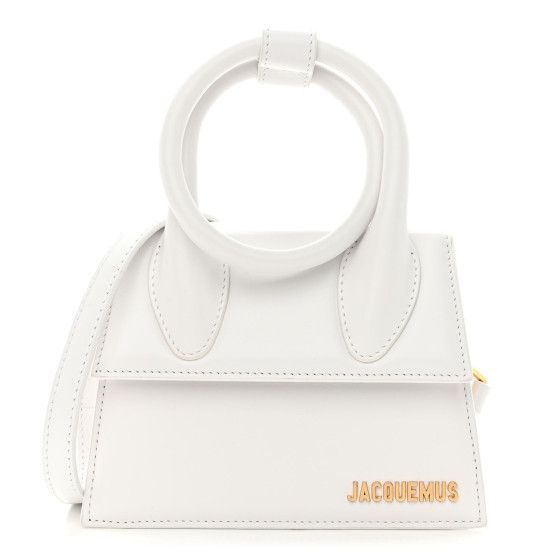 This is the authentic  JACQUEMUS Smooth Calfskin Le Chiquito Noeud in White. This chic bag is crafted of smooth calfskin leather in white. The bag features a stylized looped handle, an optional leather shoulder strap, and gold hardware. The front flap opens to a beige fabric interior with a pocket. Jacquemus Le Chiquito, Jacquemus Bag, Chic Bags, Press Studs, Dolce & Gabbana, White Bag, Ballerinas, Missoni, Leather Top