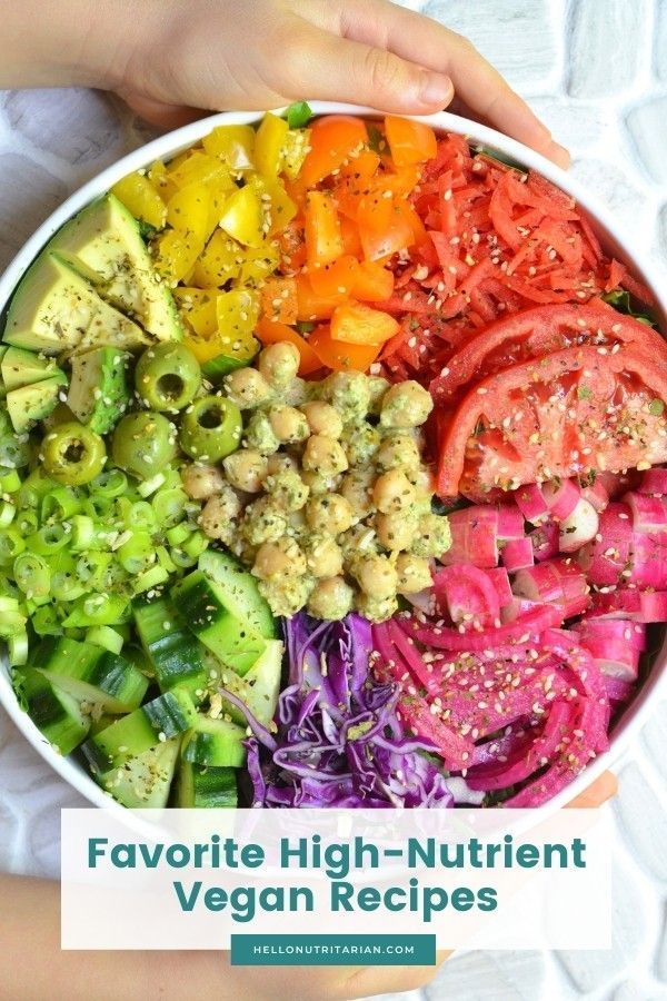 a person holding a bowl filled with different colored vegetables and the words favorite high - nutritious vegan recipes