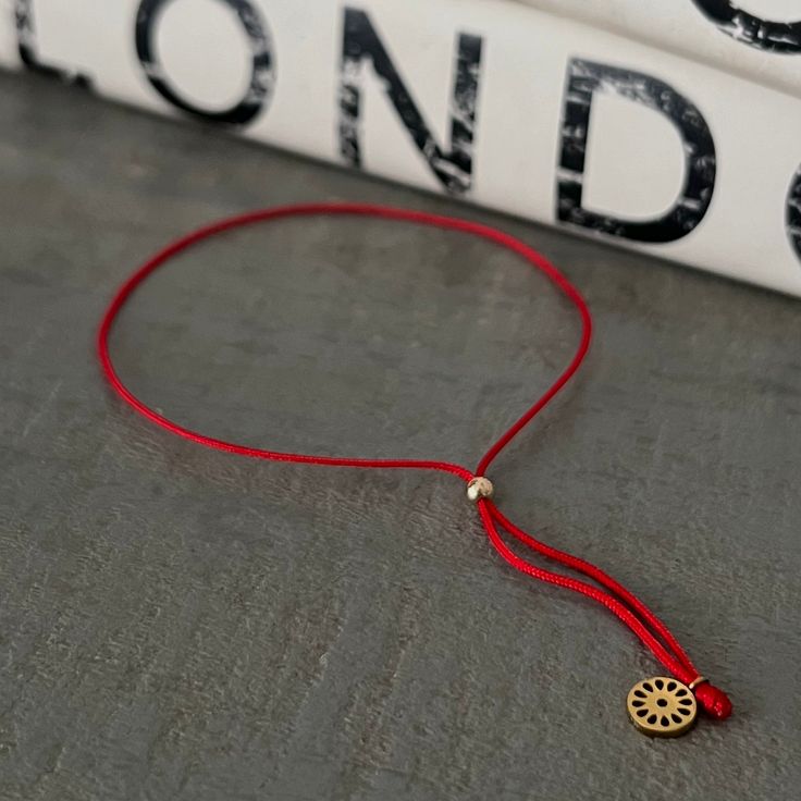 Adjustable red string bracelet with mini signature flower. Tom Y Jerry, Red String Bracelet, Red String, String Bracelet, Cross Necklace, Bracelet, Red, Quick Saves