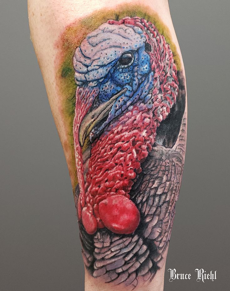 a tattoo with a turkey on it's leg