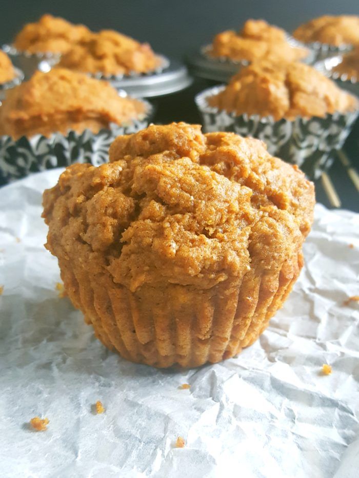 a muffin sitting on top of a table next to other muffins