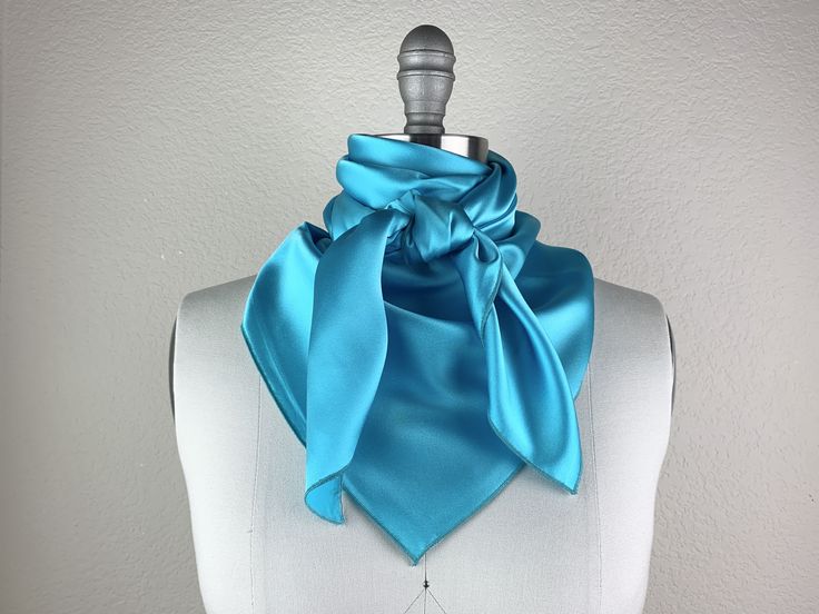 Beautiful handmade silk scarf. Pair this beauty with your favorite CR RanchWear shirt for a classy show look. 100% Imported Silk Size: 36x36 inches Made in Dallas, Texas Elegant Silk Scarf With Satin Finish For Summer, Elegant Satin Finish Silk Scarf For Summer, Elegant Blue Satin Silk Scarf, Blue Satin Silk Scarf As Gift, Blue Satin Silk Scarf For Gift, Chic Blue Scarves For Gifts, Chic Blue Silk Scarf As Gift, Blue Silk Scarf For Wedding, Elegant Blue Scarves For Wedding