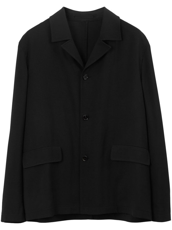 black wool camp collar front button fastening two front flap pockets long sleeves buttoned cuffs central rear vent straight hem Oversized Button-up Business Blazer, Classic Black Oversized Wool Coat, Oversized Business Casual Outerwear With Suit Collar, Black Sport Coat For Work With Concealed Placket, Black Sport Coat For Work, Oversized Single-breasted Pea Coat For Business, Black Wool Blazer With Lapel Collar, Black Single Breasted Wool Coat With Lapel Collar, Black Pea Coat With Button Cuffs And Lapel Collar