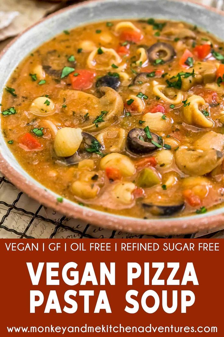 vegan pizza pasta soup in a bowl on a cooling rack with text overlay