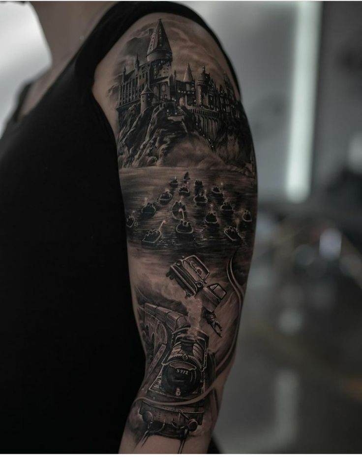 a person with a black and grey tattoo on their arm