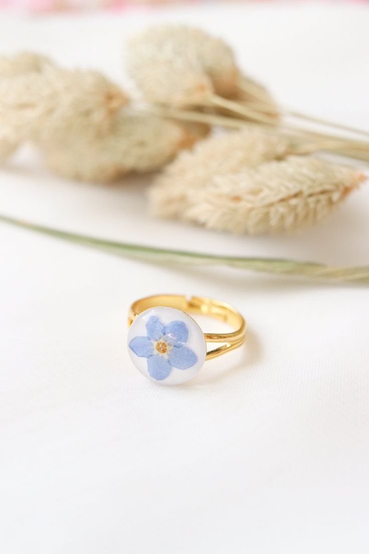 Delicate Birth Flower Ring Gift, Flower Shaped Pressed Flowers Rings, Flower Shaped Rings With Pressed Flowers As Gifts, Flower Shaped Rings With Pressed Flowers, Promise Flower Ring With Birth Flower, Nature-inspired White Flower Ring, Adjustable Blue Flower Ring For Gifting, Hypoallergenic Flower Ring For Gift, Hypoallergenic Flower Ring Gift