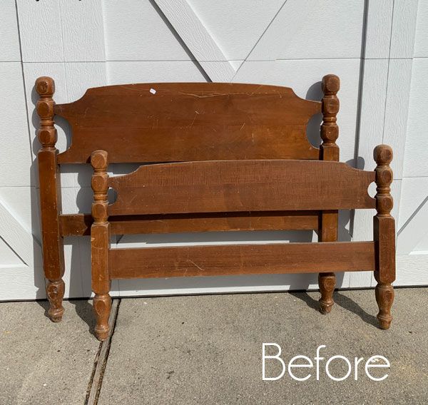 a wooden bench sitting in front of a garage door with the words before painted on it