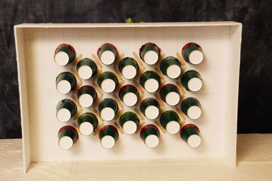 a white box filled with cups sitting on top of a table