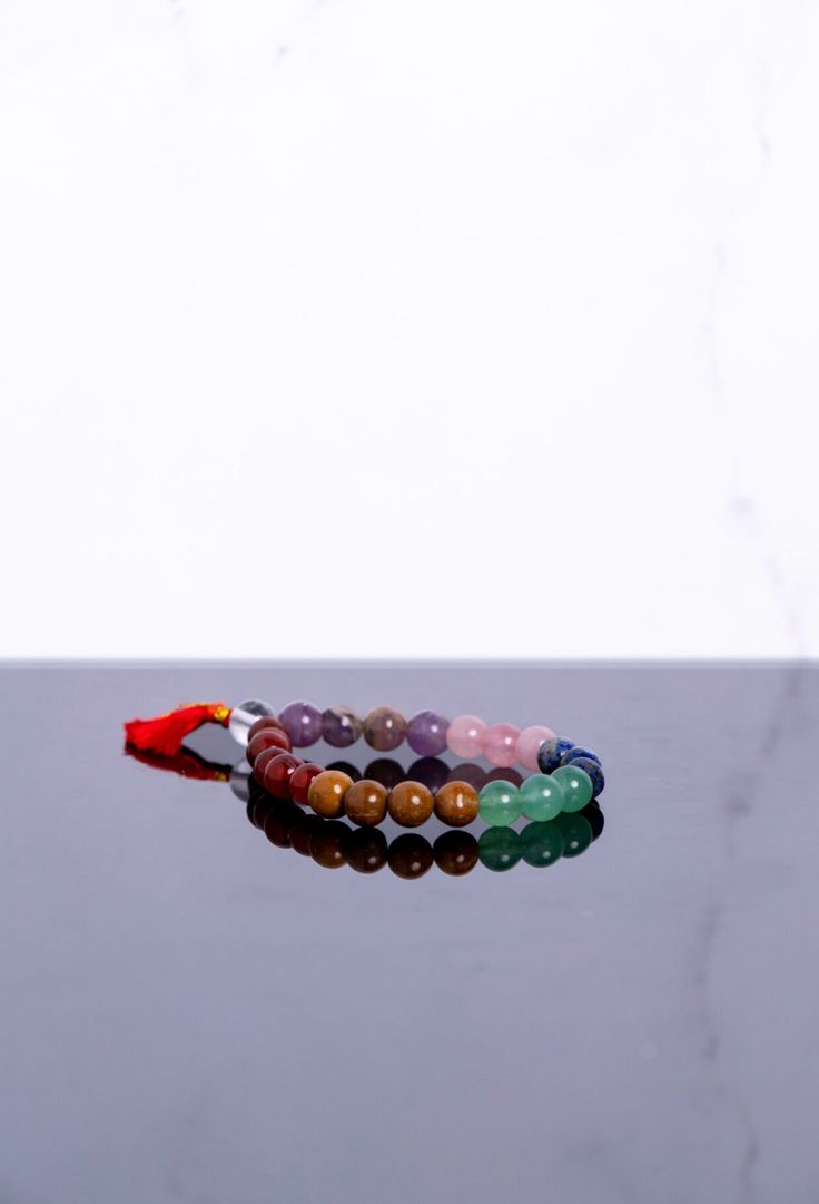 Introducing our 7 Chakra Stone Bracelet, a stylish and practical way to adorn yourself with the beauty of gemstones while harnessing their powerful energies. With a durable elastic cord and genuine small beaded details, this bracelet offers a convenient and fashionable means to keep the energy of your seven chakras with you throughout the day. Key Features: Stones: This bracelet is composed of a carefully selected array of gemstones, each aligned with a specific chakra. The stones include Clear Adjustable Multicolor Crystal Bracelet For Healing, Spiritual Crystal Bracelet With Colorful Beads For Meditation, Multicolor Gemstone Spiritual Stretch Bracelet, Spiritual Multicolor Gemstone Stretch Bracelet, Adjustable Multicolor Bracelets For Meditation, Spiritual Multicolor Gemstone Beads Stretch Bracelet, Adjustable Crystal Bracelet With Colorful Beads For Meditation, Multicolor Spiritual Stretch Bracelet, Adjustable Rainbow Beaded Bracelets For Meditation