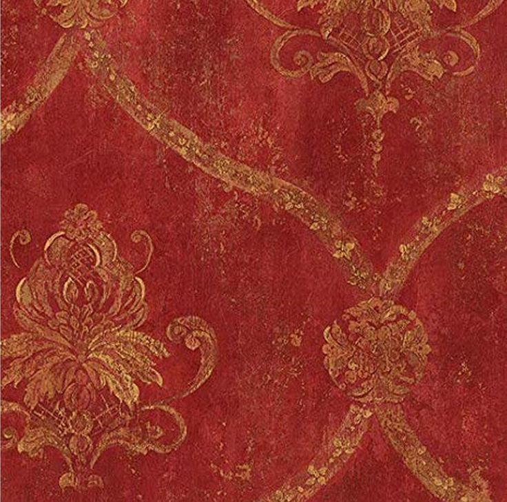 an old red and gold wallpaper with ornate designs on the edges, including swirls