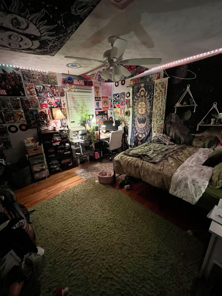 a bed room with a neatly made bed and lots of decorations on the wall above it