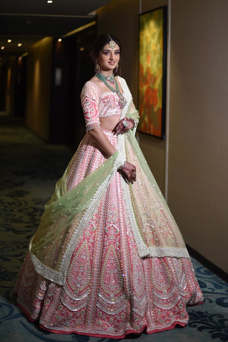 The Jasmine Set is a heavily embroidered bridal set with beautiful sequins, cut dana and pearl work. This Lehenga is paired with two gorgeous embroidered net and organza dupatta.DELIVERY TIMEPlease allow 8-12 weeks for your outfit to arrive.FABRIC DETAILSPure raw silk, net, organza.Professional cleaning only.