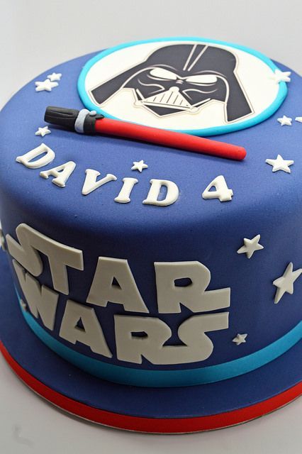 a star wars themed birthday cake with darth vader on top