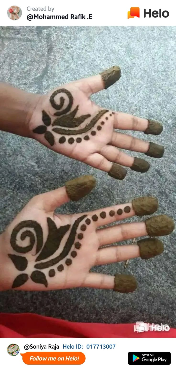 two hands with henna designs on them