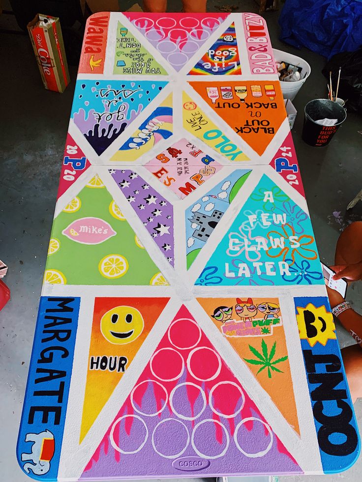 a table that has been decorated with various stickers on it