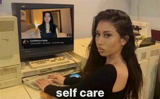 a woman sitting in front of a computer with the caption self care