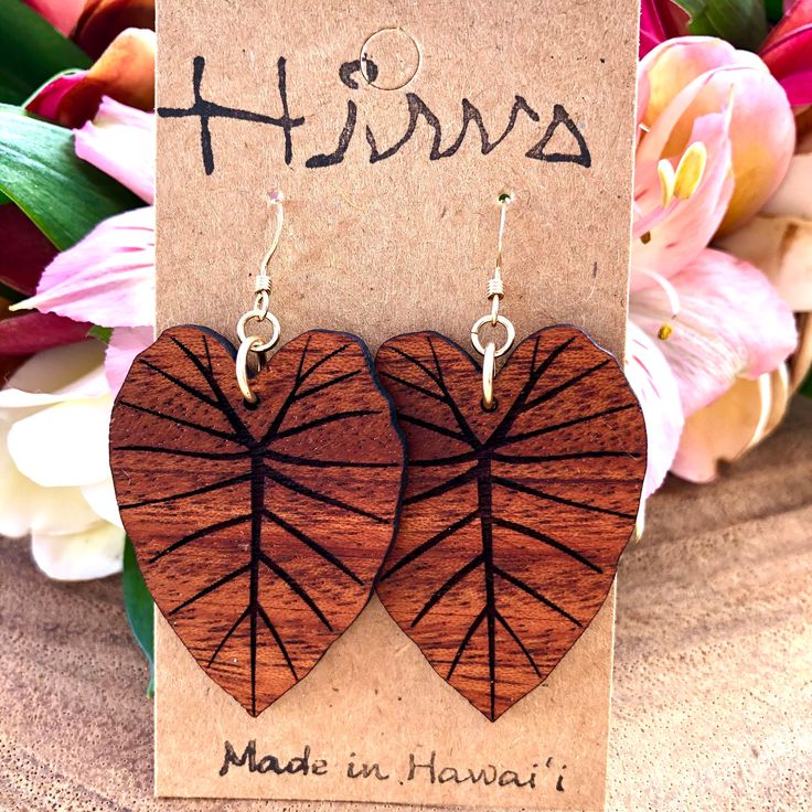 Kalo design earring made with Hawaiian Koa Wood. Kalo is the ancestor of Hawaiian people. It is sacred and important here in Hawai'i. These earrings are laser cut and handmade on O'ahu. The length is measured from the top of the hook. It is finished with 14k Gold filled or Sterling Silver Coil Ball Earring Hooks for Large size. For medium and small size, we use 14k Gold FIlled or Sterling Silver Coil only Earring Hooks. Please note the color/size you want.  We repurpose the left over, discarded, Leaf-shaped Jewelry With Matching Earrings, Leaf-shaped Earrings With Ear Wire For Gift, Unique Leaf-shaped Earrings For Gift, Leaf-shaped Brown Earrings Gift, Handmade Leaf-shaped Earrings For Gift, Leaf-shaped Jewelry Gift, Brown Leaf-shaped Earrings For Gift, Brown Leaf-shaped Jewelry For Gift, Brown Leaf-shaped Earrings Gift