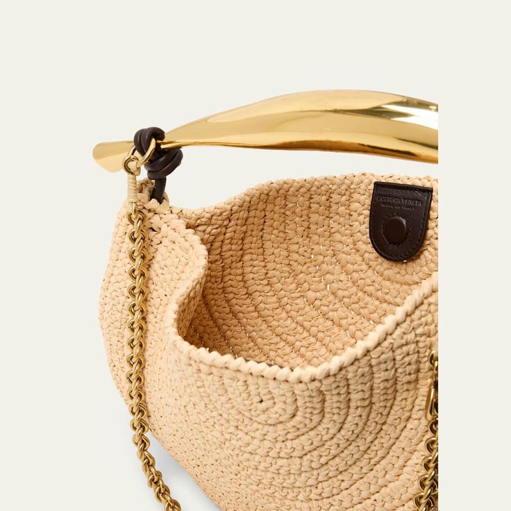 Bottega Veneta "Sardine" top handle bag in crochet raffia and leather  Metal top handle Chain shoulder strap Can be worn as a top handle or shoulder bag  Open top with magnetic closure  Approx. 7.9"H x 13"W x 1.6"D Made in Italy Luxury Straw Bag With Braided Round Handles, Luxury Evening Straw Bag With Bamboo Handle, Luxury Natural Crochet Bag With Detachable Handle, Straw Top Handle Bag With Gold-tone Hardware, Luxury Straw Bag With Round Handle, Evening Straw Tote Bag With Detachable Handle, Evening Shoulder Bag With Bamboo Handle In Natural Color, Beige Straw Bag With Gold-tone Hardware And Top Handle, Beige Top Handle Straw Bag With Gold-tone Hardware