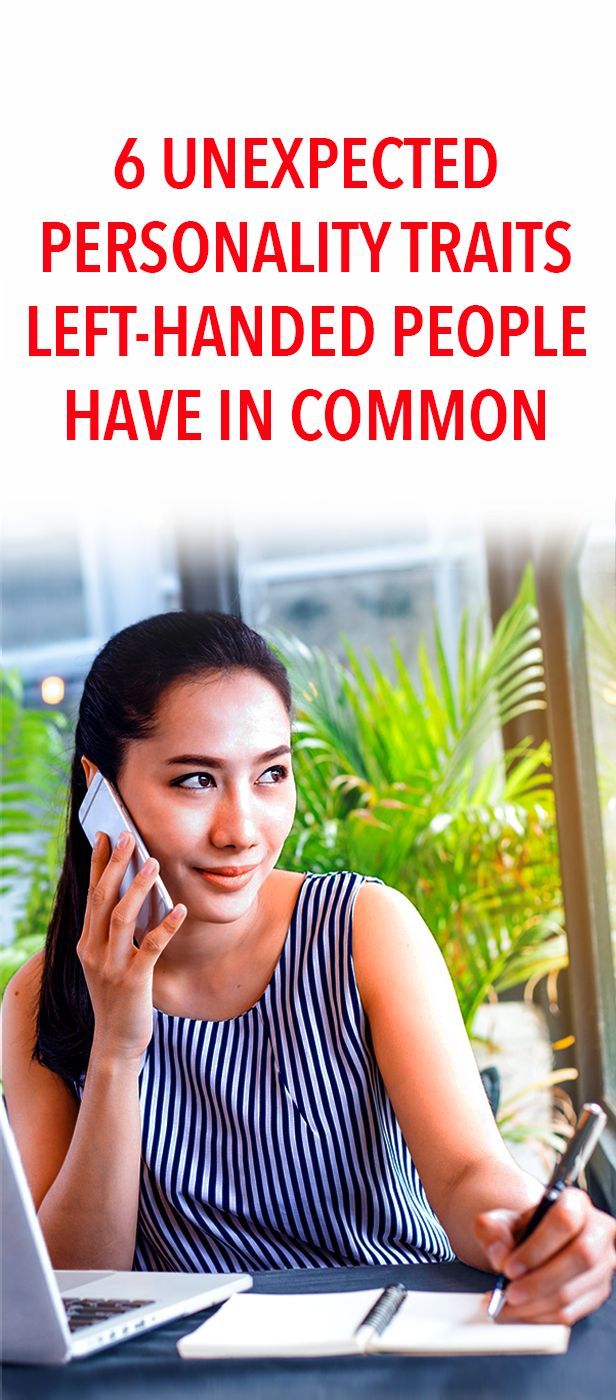 a woman sitting at a table talking on a cell phone and holding a pen in her hand