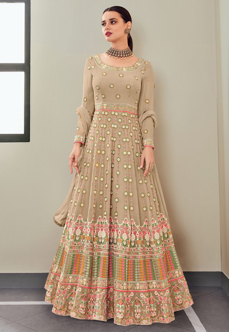 Beige georgette embroidered long anarkali suit 113  Desc:  Style : Long Anarkali Suits Color : Beige Fabric : Georgette Work : Embroidery Occasion : Festival   Christmas   Diwali   Eid   Party Wear   Engagement   Ceremonial   Baby Shower   Marriage Anniversary Wash Care : Dry clean Sleeve Style : Full Sleeve Long Sleeves : Done only in Custom Stitch Sleeves Lining : Done only in Custom Stitch Bust Size: 32 to 42 Inches. With Express Free Shipping and Custom Stitching, Buy Indian Wedding Party We Georgette Anarkali Suits, Salwar Suits Party Wear, Georgette Anarkali, Long Anarkali, Gown With Dupatta, Ethnic Gown, Party Wear Gown, Designer Anarkali, Anarkali Gown