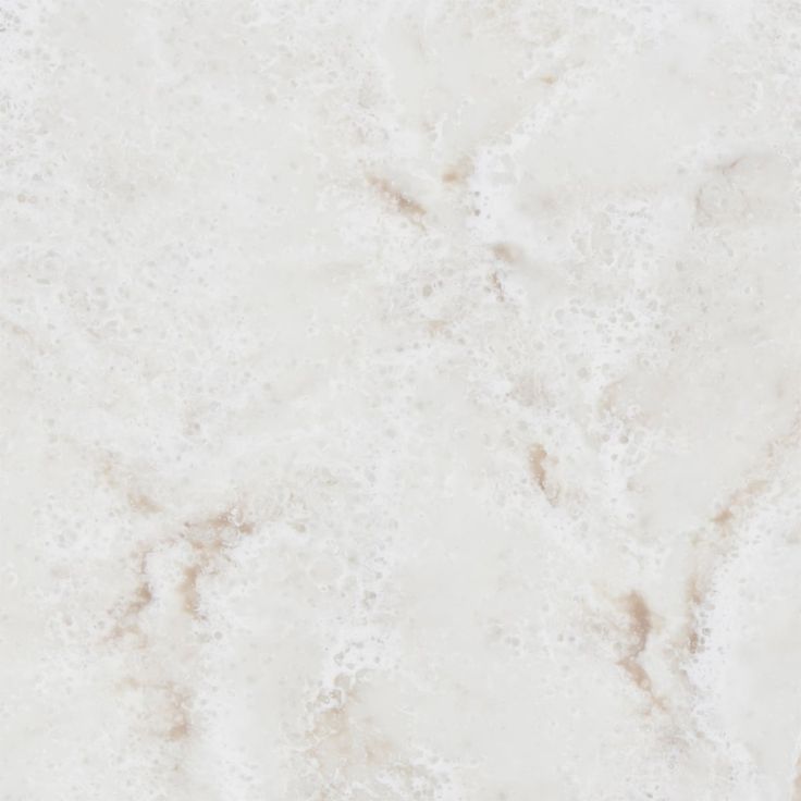 a white marble textured background with some brown spots