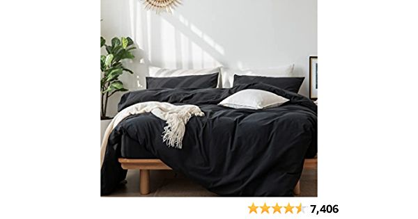 an image of a bedroom setting with black linens