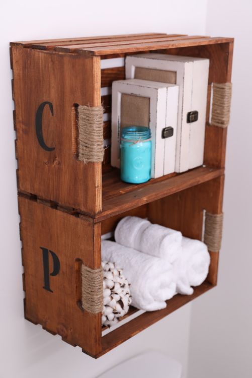 a wooden shelf with towels and other items on it