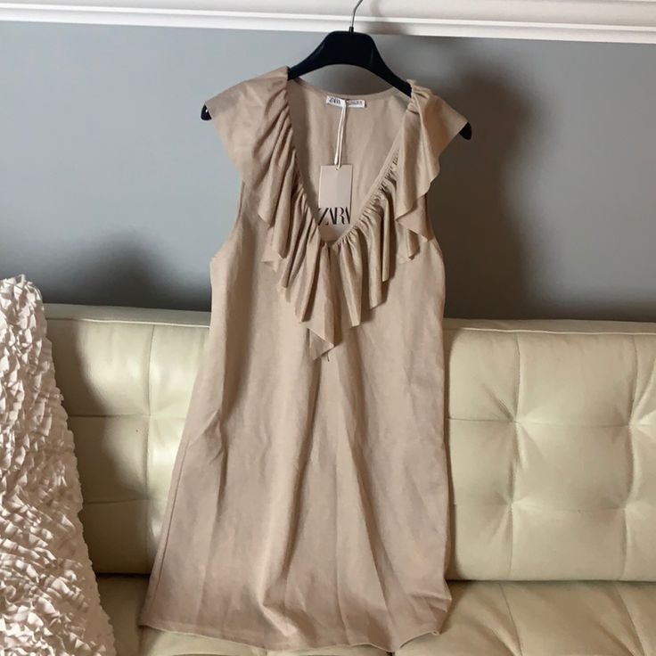 New. Didn’t Get To Wear Because I Was Expecting. Very Cute Dress! Chic Beige Summer Ruffle Dress, Chic Beige Ruffle Dress For Summer, Casual Beige Ruffled Dress, Casual Beige Dresses With Ruffles, Chic Daywear Ruffle Sleeve Dress, Chic Zara Mini Dress With Ruffle Hem, Chic Beige Ruffle Dress For Spring, Chic Ruffle Sleeve Dress For Daywear, Zara Sleeveless Dress With Ruffle Hem