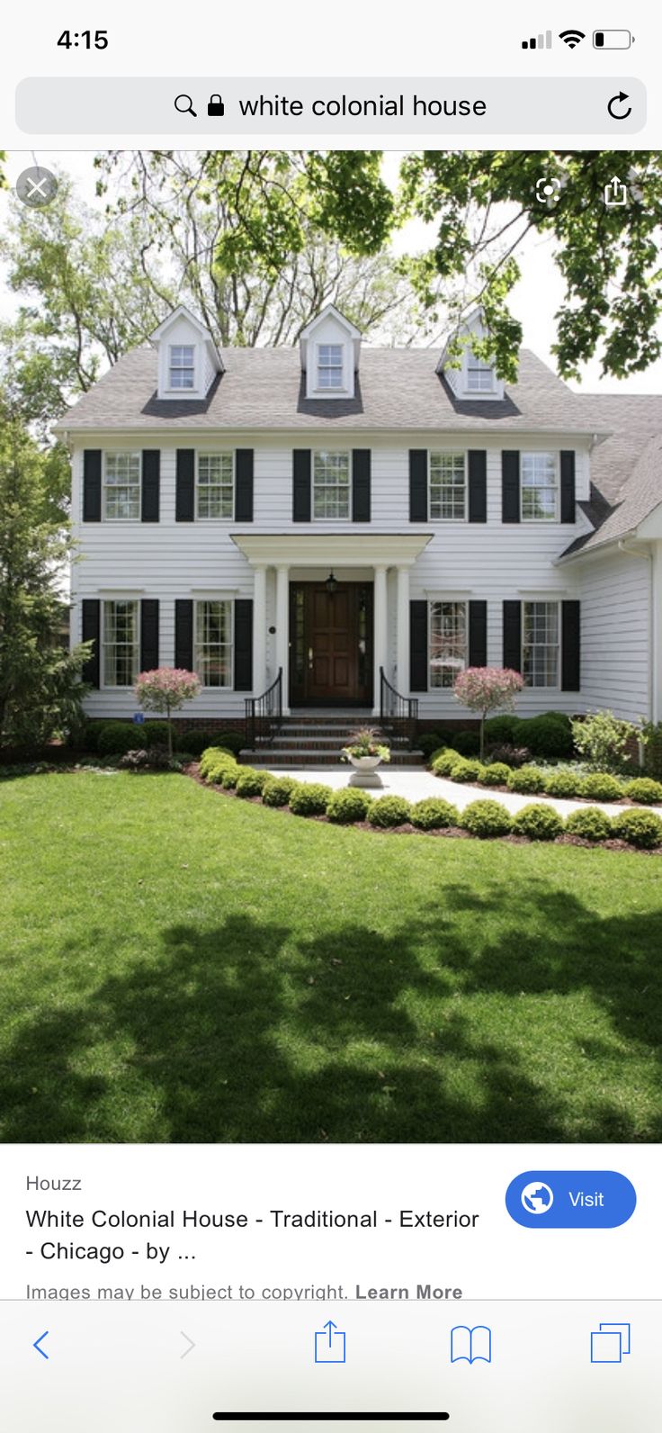 a white house with black shutters and a red door for the home pinterest