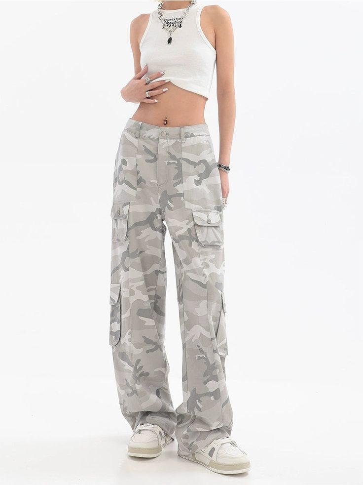 Embrace the streetwise sophistication with these Faded Camo Cargo Pants, the perfect blend of edgy style and functionality. Crafted from a durable yet comfortable fabric, these pants feature a timeless camouflage pattern with a modern faded twist. Designed with an abundance of pockets, they offer practical utility for everyday wear while maintaining a sleek, straight-leg silhouette. The loose fit allows for ease of movement, making them a go-to choice for a nonchalant, yet put-together look. Per Light Camo Pants, Cargo Pants With Pockets, Army Print, Camouflage Pants, Camo Cargo Pants, Edgy Style, Camo Pants, Pants With Pockets, Printed Pants