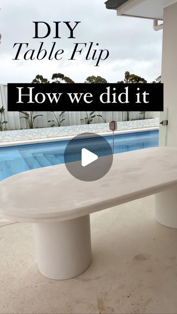 a white table sitting in front of a pool with the words diy table flip on it