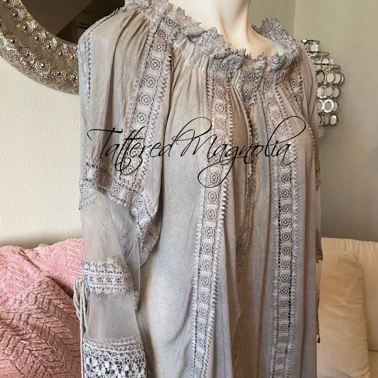 Normal Retail $128.00 This Is A Romantic Lightweight Linen Look Blouse With Mesh Lace Sleeves And Lace Trim. It Is A Light Grey In Color. It Has An Elastic Neckline That Can Be Worn On The Shoulders Or Off. The Sleeves Have A Pretty Tassel Tie. Great Cruise Or Beach Wear. Super High Quality From Pol If You Like Free People, Johnny Was, Spell & The Gypsy Or Anthroplogie, Check Out My Closet! Bohemian Fall Blouse With Ruffles, Bohemian Peasant Top For Fall Gatherings, Bohemian Ruffle Blouse For Fall, Bohemian Ruffled Blouse For Fall, Bohemian Long Sleeve Blouse For Gatherings, Long Sleeve Bohemian Tops For Gatherings, Bohemian Tops For Fall Gatherings, Spring Peasant Tunic Dress, Billowy Bohemian Peasant Top For Fall