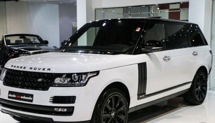 the white range rover is on display at an auto show