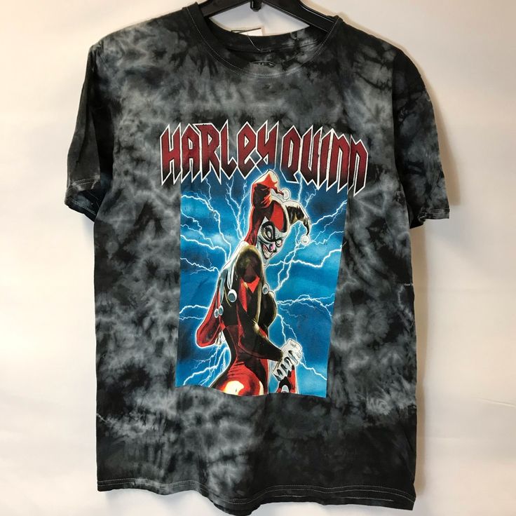 a black tie - dye shirt with an image of harley and the flash on it