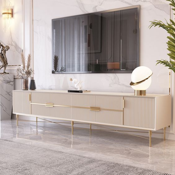 an elegant living room with marble walls and flooring, including a large mirror on the wall