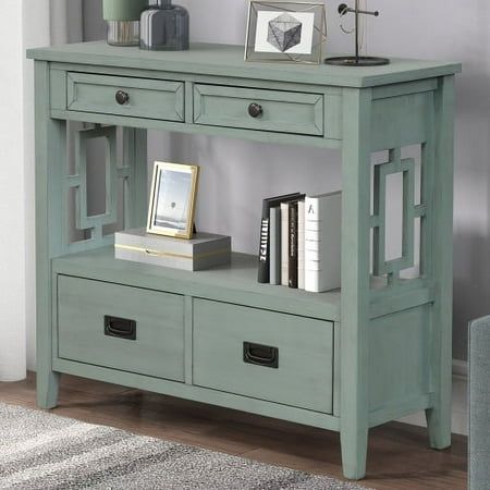 a blue console table with two drawers and bookshelves on the top, in front of a gray wall