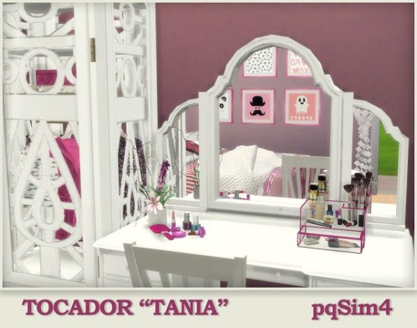 there is a white vanity with pink accents on the walls and table in front of it