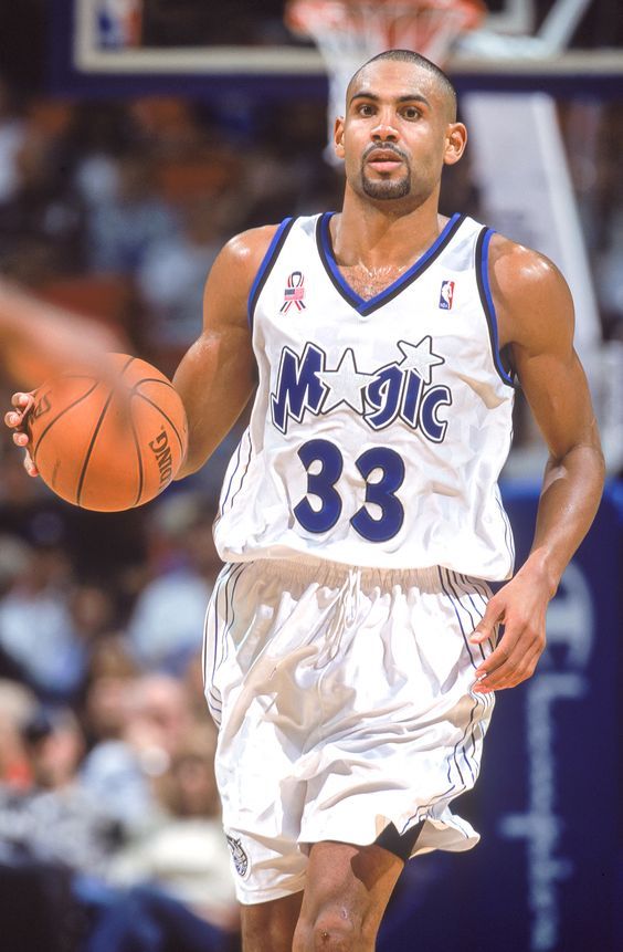 a basketball player dribbling the ball during a game