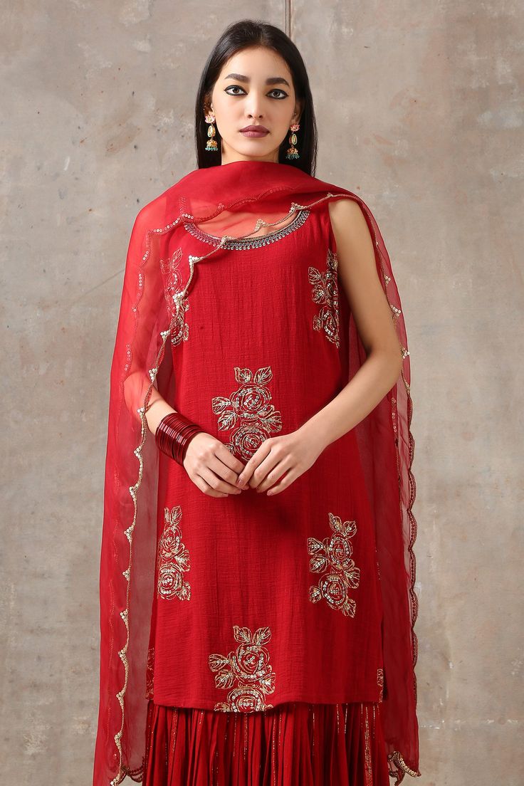 Red kurta with floral embroidered motifs and attached gharara style layer. Paired with organza scallop dupatta.
Component: 2
Embroidered
Neckline: Scoop neck
Sleeve Length: Sleeveless
Fabric: Cotton Slub, Organza
Color: Red
Aari work
Scallop dupatta
Attached gharara style bottom layer - Aza Fashions Scallop Dupatta, Kurta With Dupatta, Red Kurta, Embroidered Motifs, Embroidered Neckline, Aari Work, Fashion App, Agra, Aza Fashion