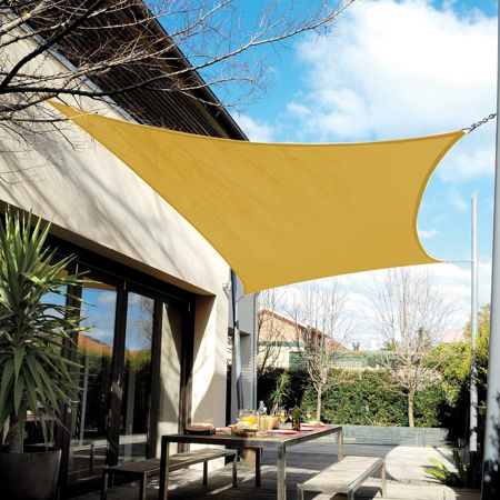 an outdoor patio with a yellow shade over it