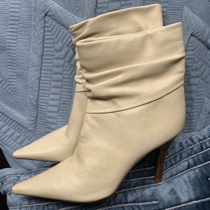 Bcbg Booties 3 1/2” Heels Chic Ankle Strap Boots For Spring, Chic Beige Leather Booties, Chic Booties With Sculpted Heel And Almond Toe, Chic Fitted Booties With Stacked Heel, Chic Cream Leather Booties, Cream Calf Leather Heels For Spring, Spring Cream Calf Leather Heels, Chic High Heel Booties With Padded Heel, Chic Leather Heels With Padded Ankle